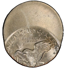Off-center strike error coin showing blank crescent of metal on one side